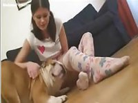 Pigtailed young cutie plays with her dog then her pussy