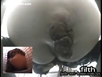Camera mounted inside of a toilet bowl captures this teen pooping