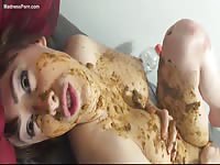 After admiring the warm moist pile of scat sitting between her big tits this rookie smears it