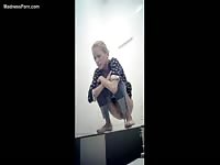 Filthy scat fetish video featuring a young girl squatting with her skirt up to shit and pee