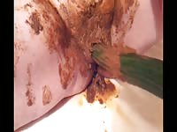 Nasty old scat slut masturbates while she is covered in shit